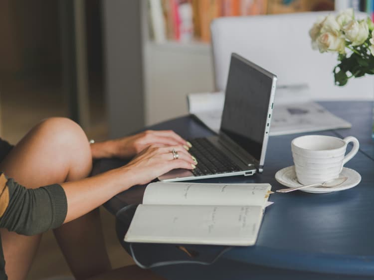 Freelancer workspace with laptop and coffee for remote work