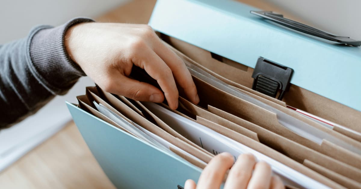 Organized filing system with folders and documents for invoice management