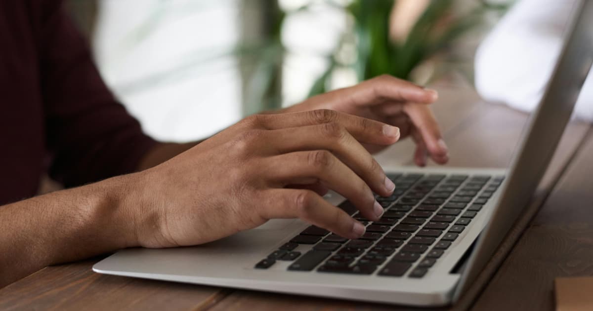 Invoicing mistakes freelancers make Freelancer working on a laptop