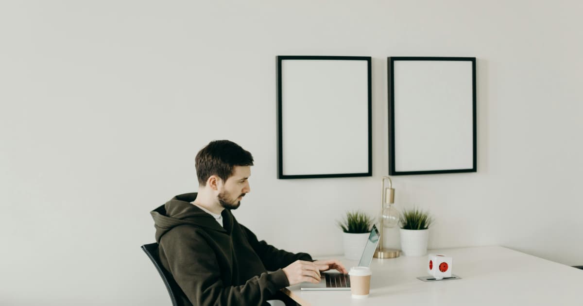 How to raise freelance rates in 2026 Confident freelancer working at a clean desk