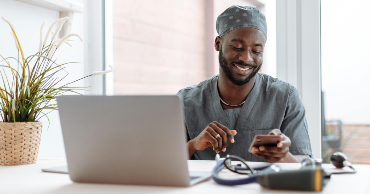 Professional sending payment reminder email on laptop