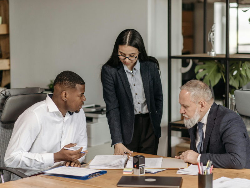 Professional meeting between freelancer and client discussing project terms