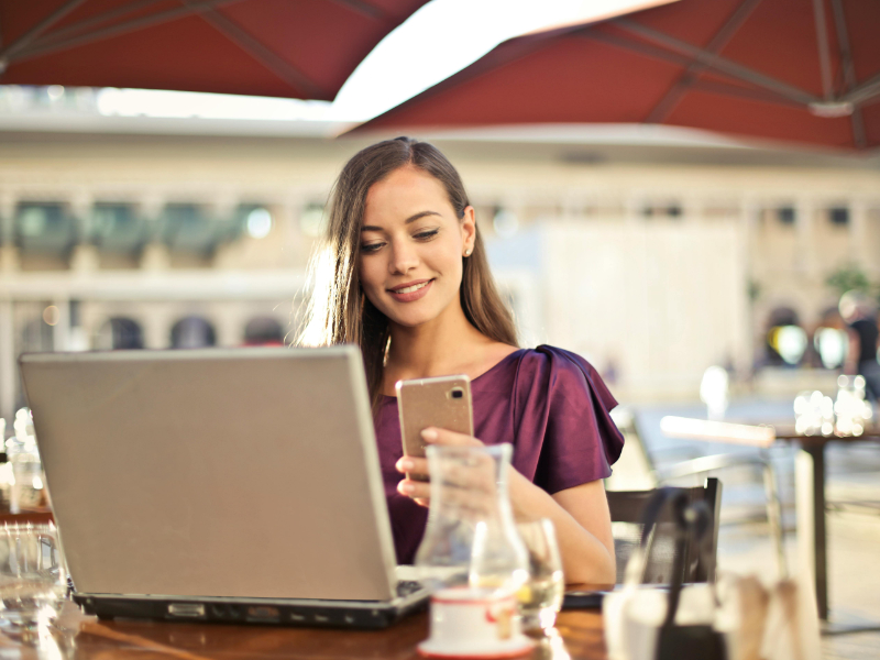 Confident freelancer working independently at outdoor café